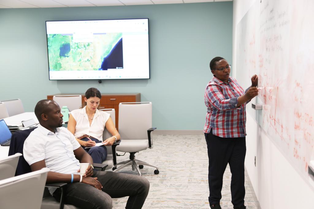 Ms. Jane Kioko (Far Right) from the Kenya Ministry of Agriculture reviews data collection protocol for the workshop group. Left-Mr. Peter Okello (KSA); Center-Ms. Taryn Devereux (UMD). 