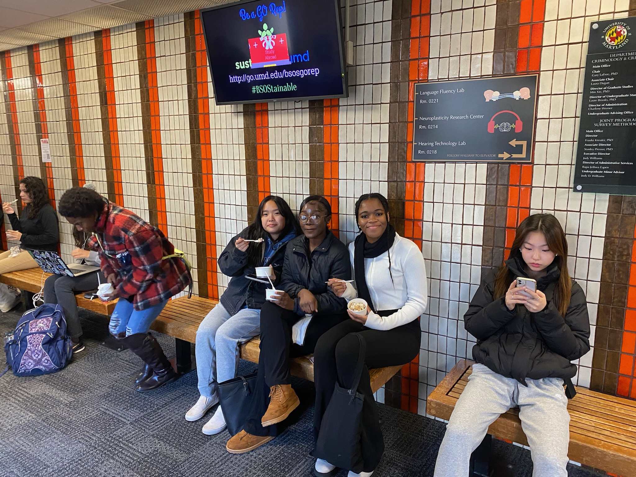 Students sit on the bench in LeFrak eating ice cream