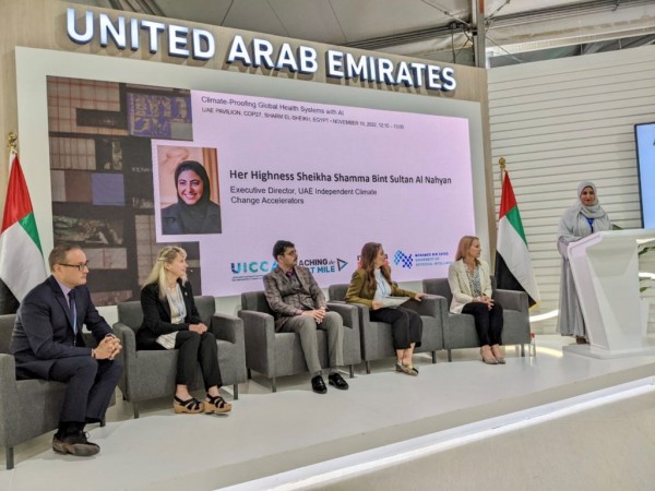 Five panelists, including Tatiana Loboda, seated on a stage as the keynote address is given